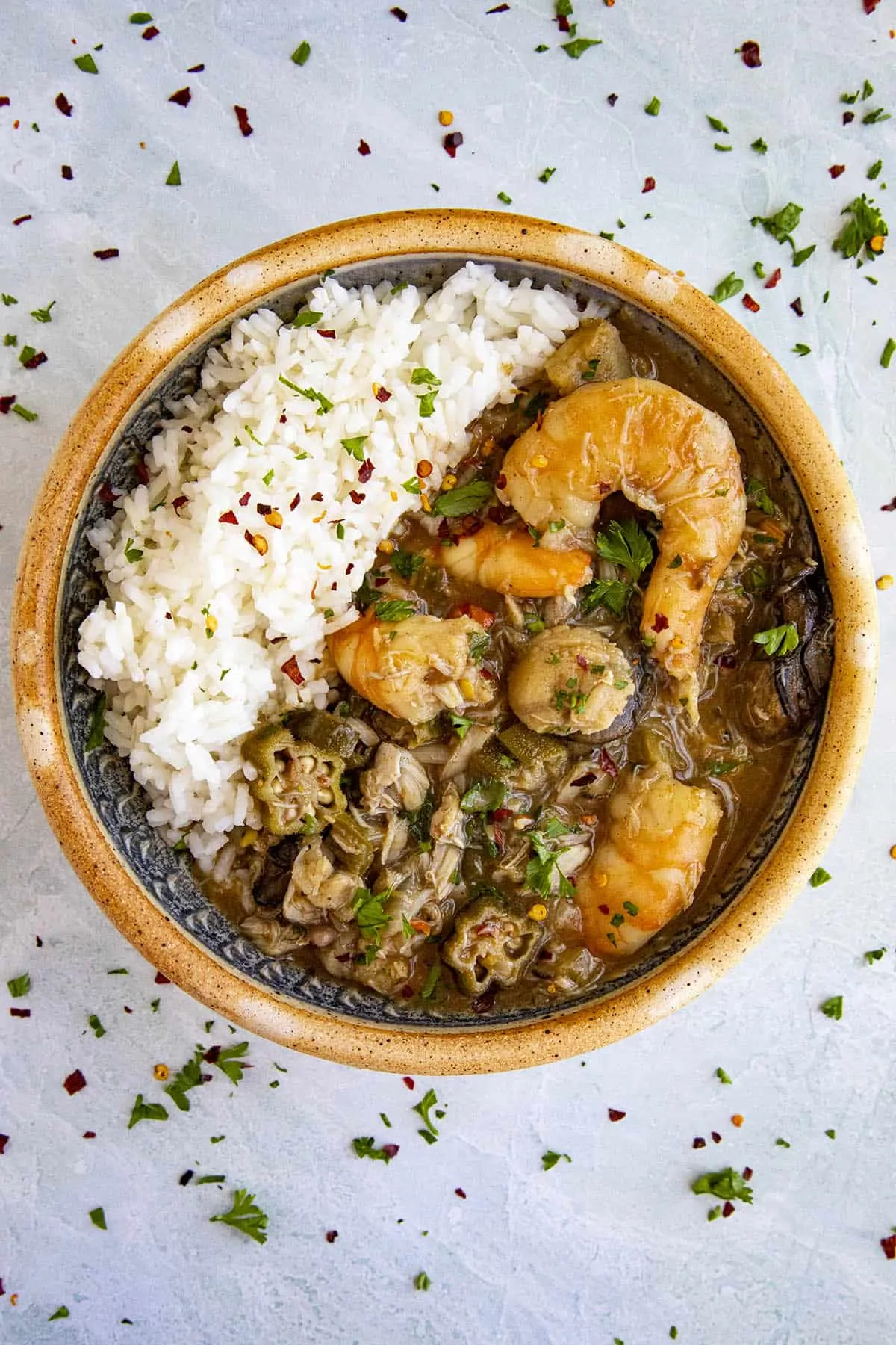 A bowl of seafood gumbo with loads of chunky seafood