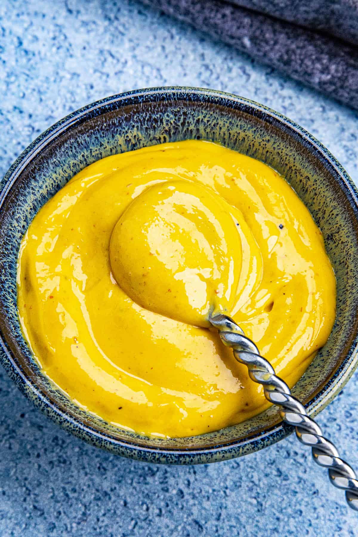 Sriracha Aioli in a bowl with a spoon