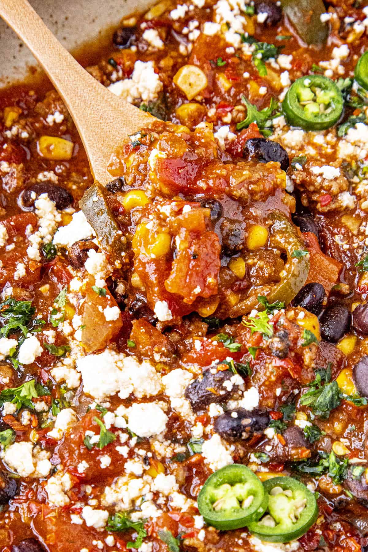 Chunky taco soup on a spoon