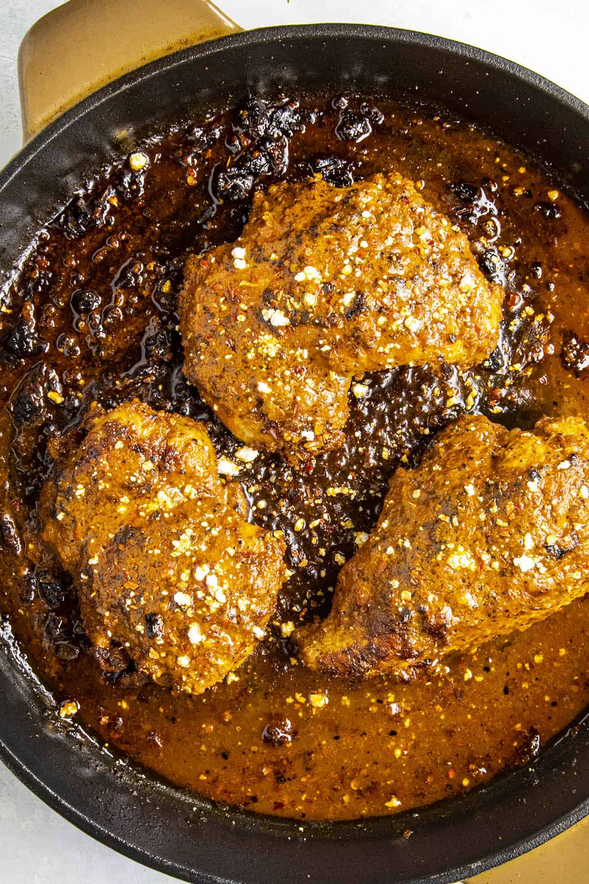 Buffalo Chicken in a pan with crumbled blue cheese