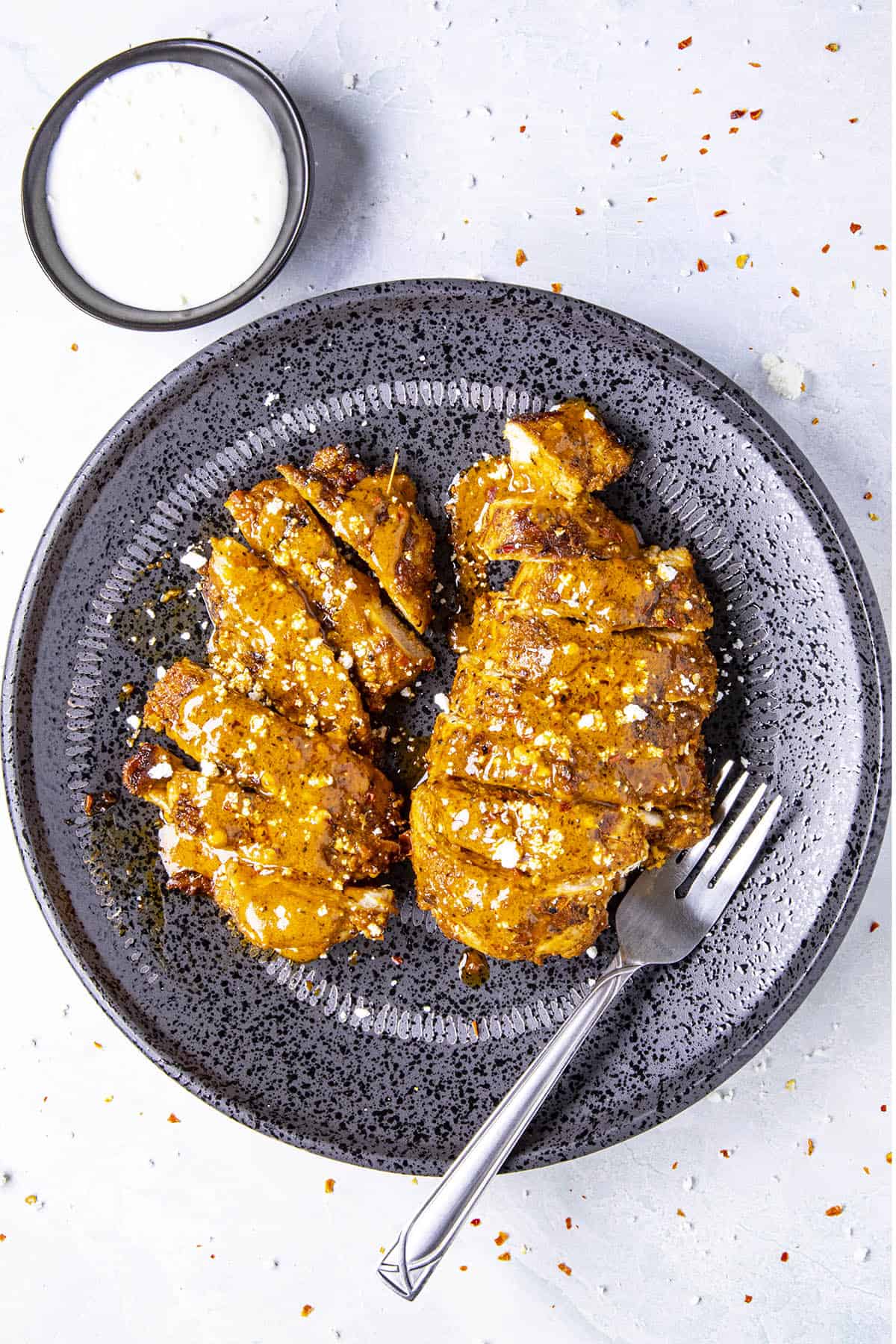 Buffalo Chicken on a plate, sliced and ready to serve