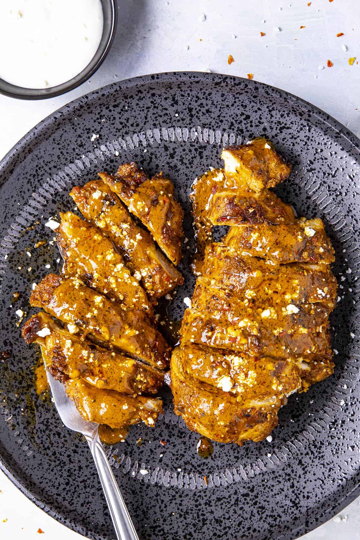 Buffalo Chicken on a plate, sliced and ready to serve