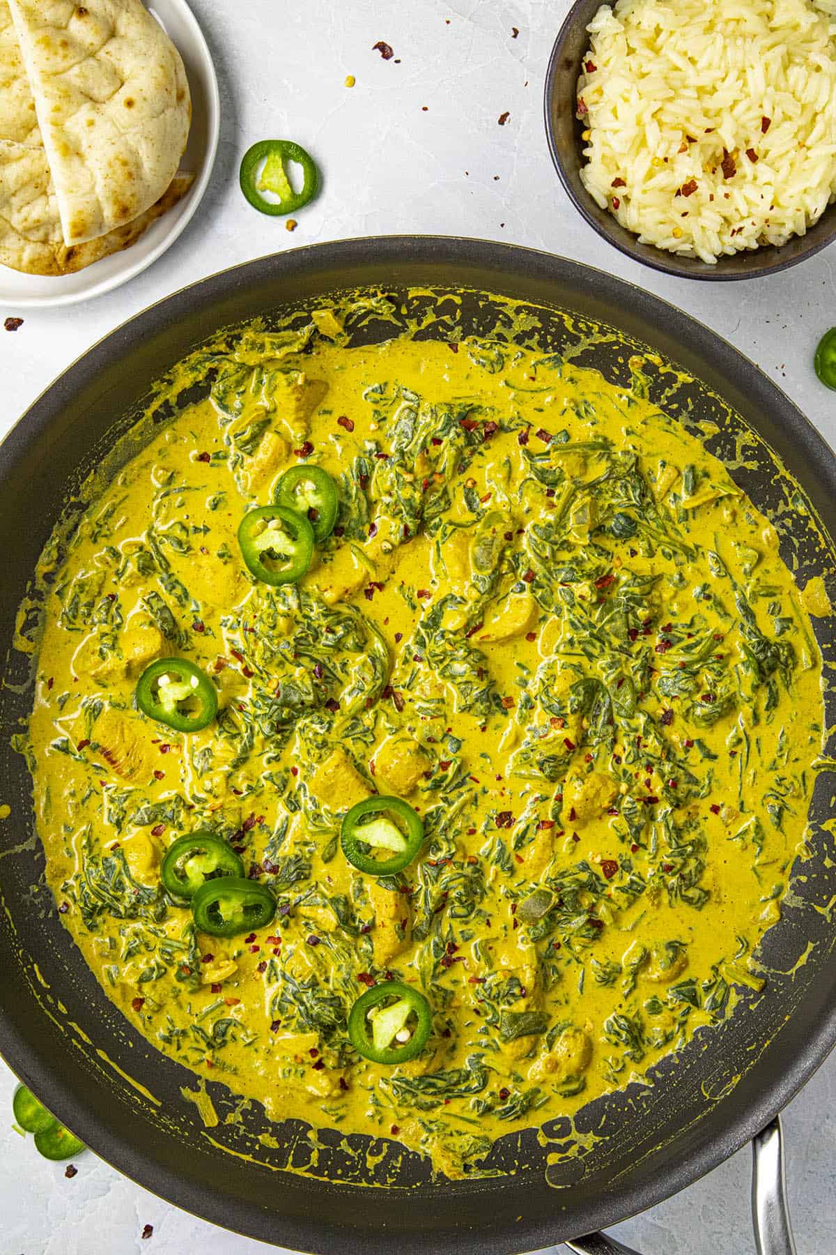 Spicy chicken saag curry in a pan