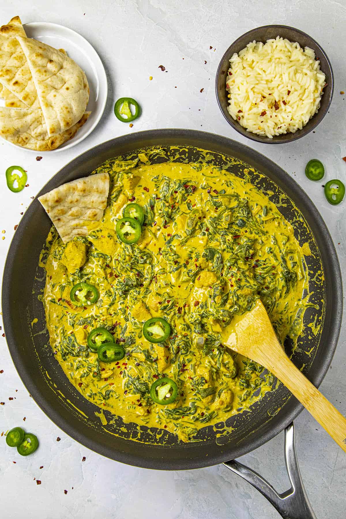 Chicken Saag with lots of peppers for garnish, ready to serve