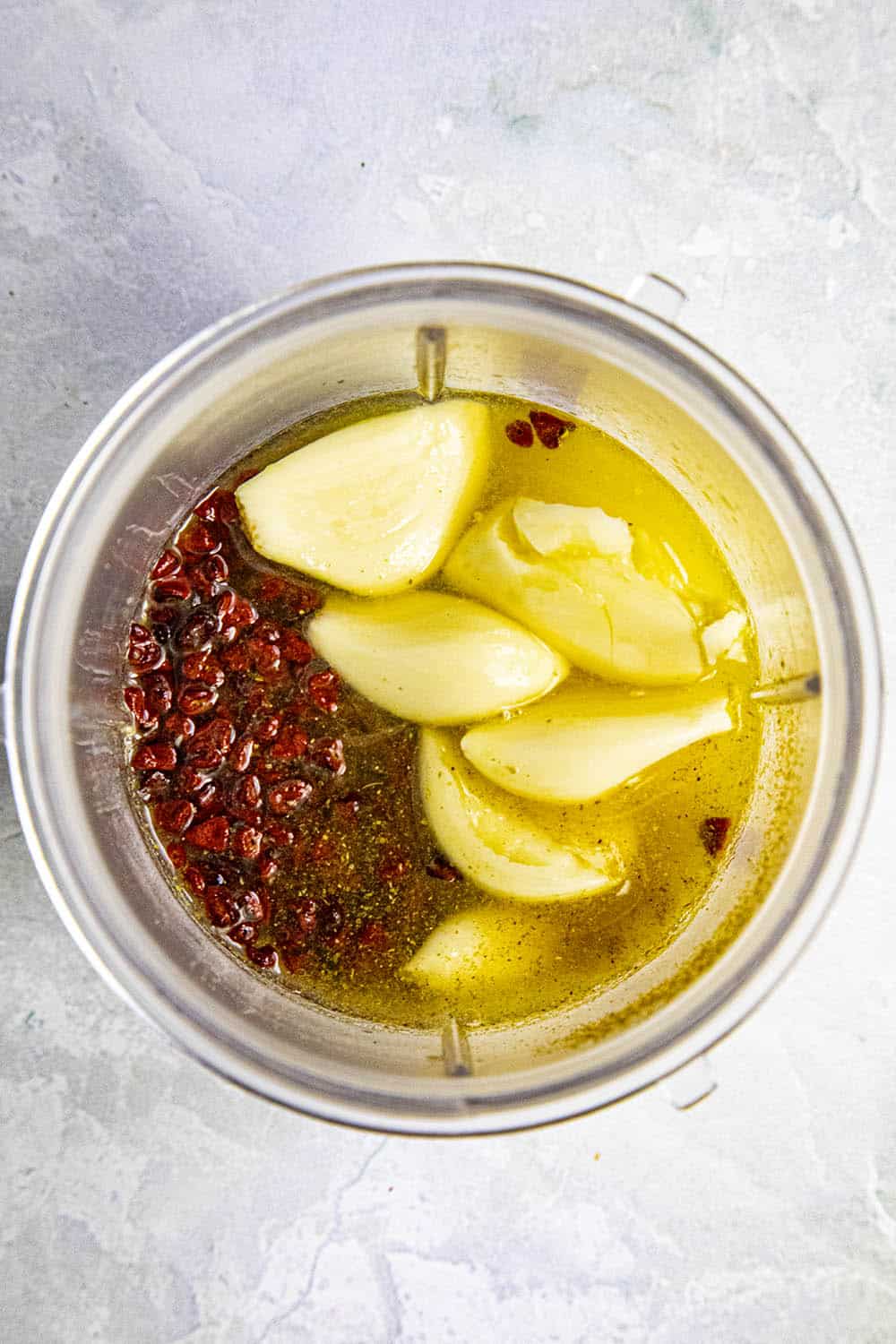 Ingredients for making achiote paste in a food processor