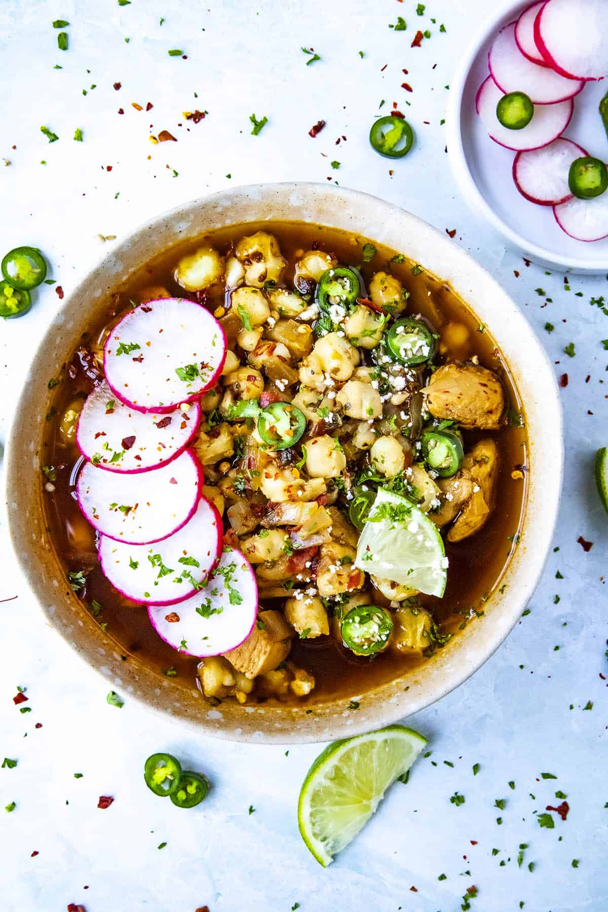 Chunky, brothy Chicken Pozole Rojo in a bowl