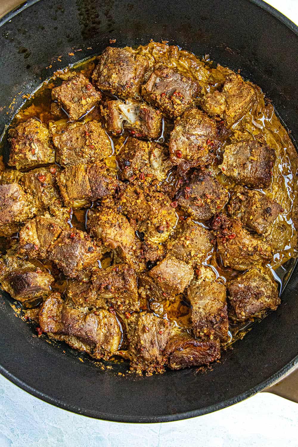 Seared and braised pork shoulder, ready to shred for making cochinita pibil