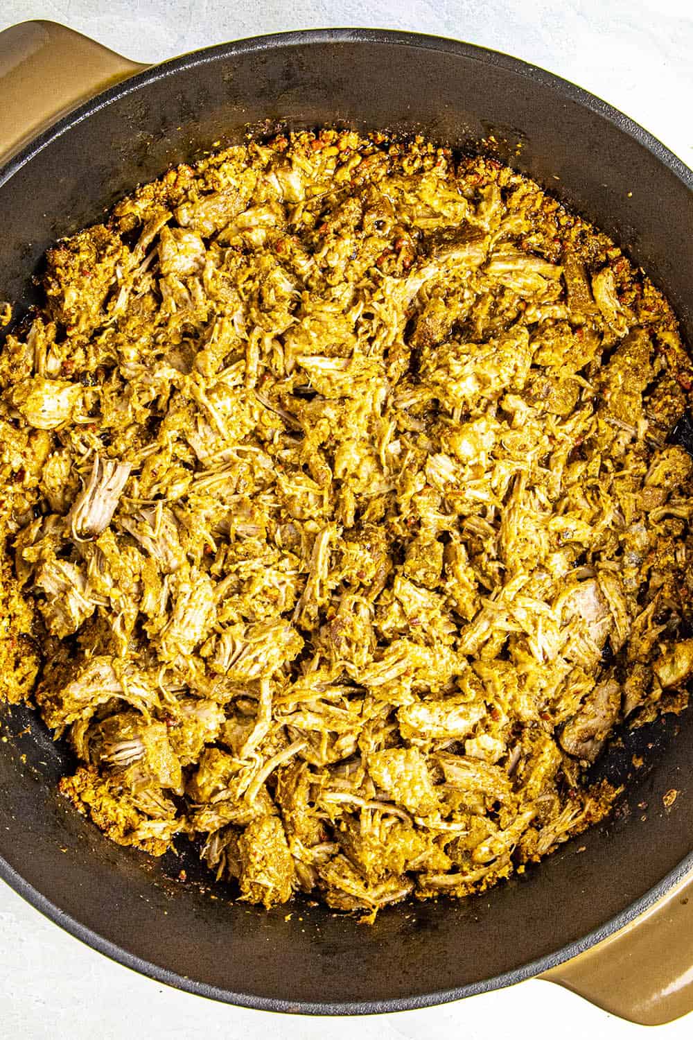 Shredded Cochinita Pibil in a pot, ready to enjoy