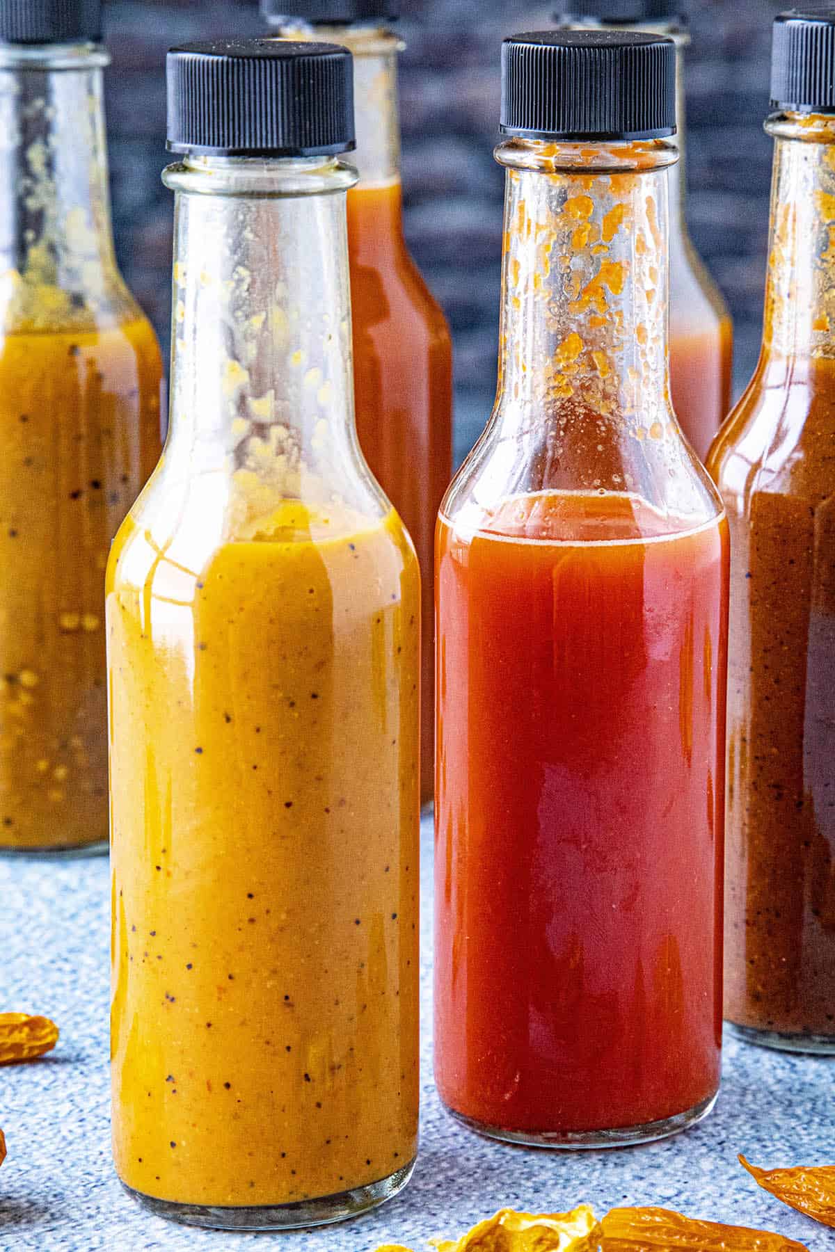 Several bottles of hot sauce made from chili powders