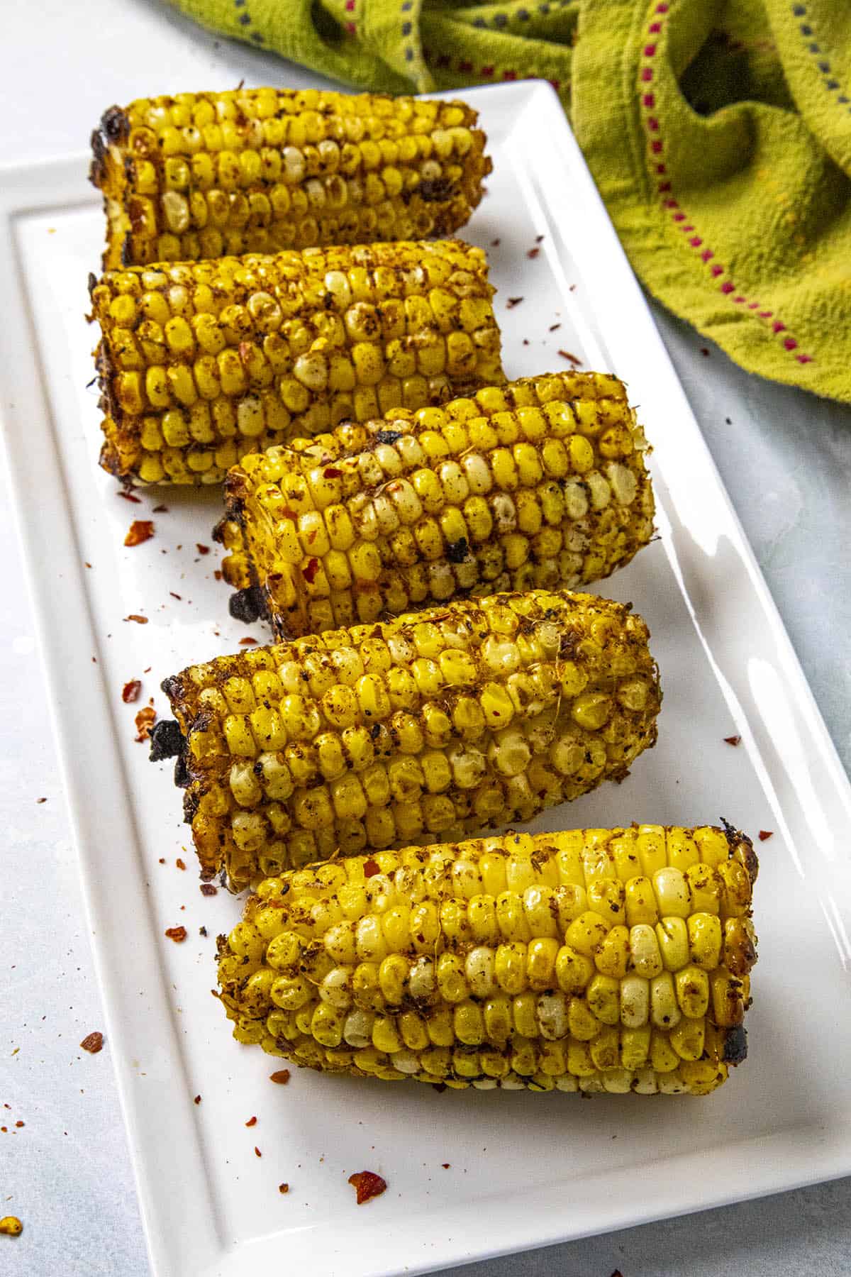 Grilled corn on the cob with plenty of jerk seasonings