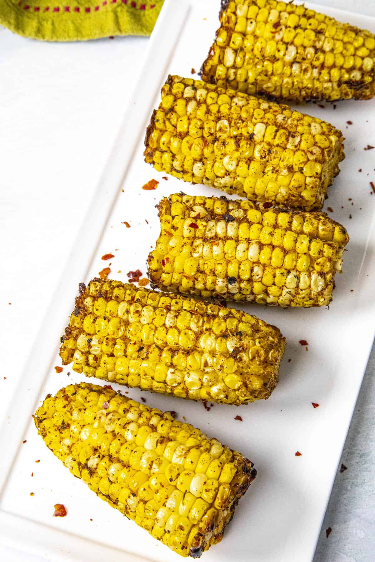 Jerk Rubbed Grilled Corn on the Cob on a plate