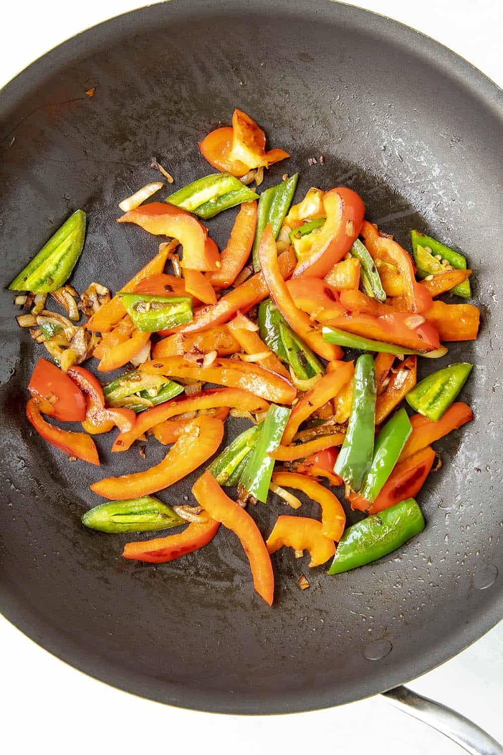 Cooking down peppers for a pepper and egg sandwich