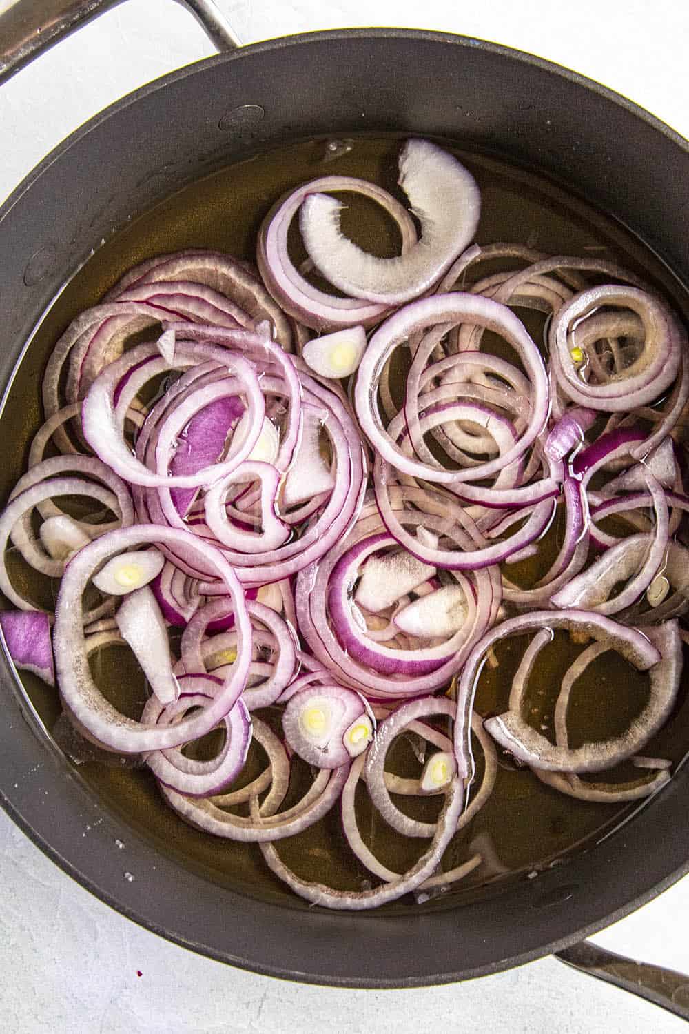 Making Pickled Red Onions in a pan