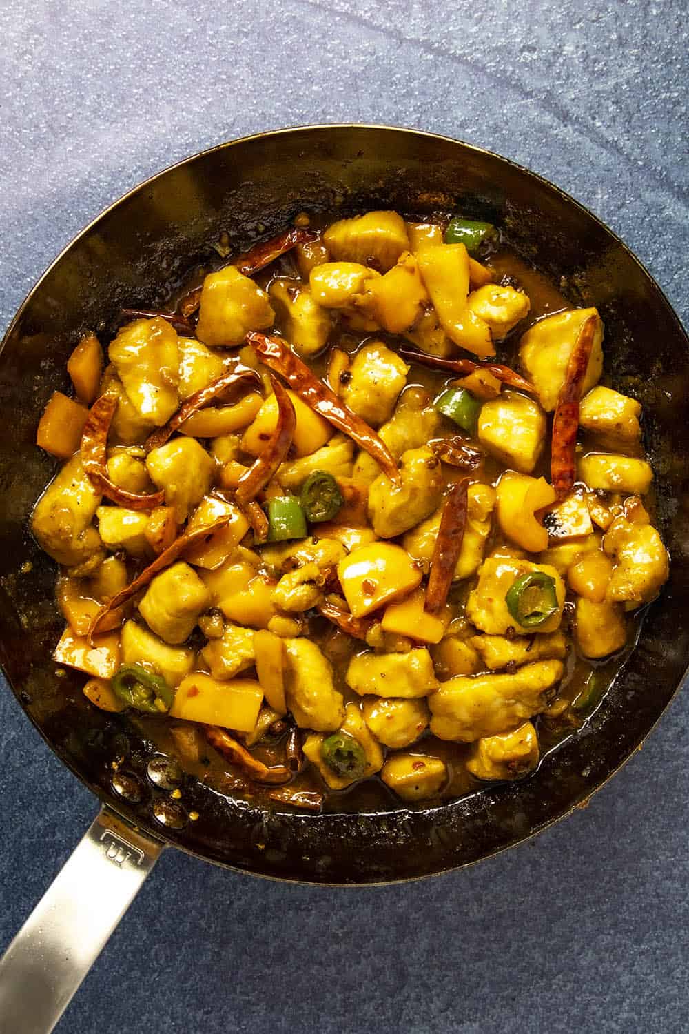 Finishing the Szechuan Chicken in a pan with Szechuan sauce
