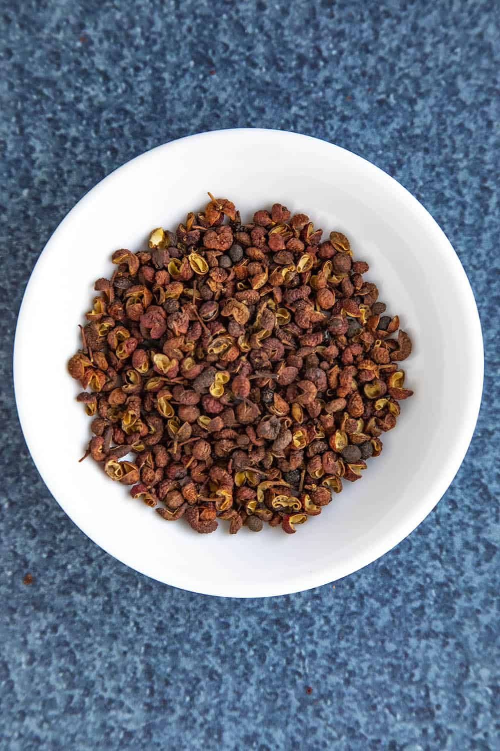 Whole Szechuan peppercorns in a bowl