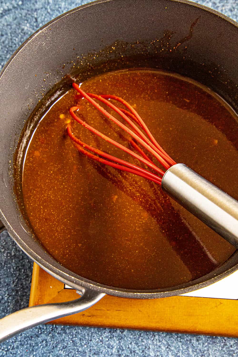Whisking the Szechuan Sauce ingredients together in a pot