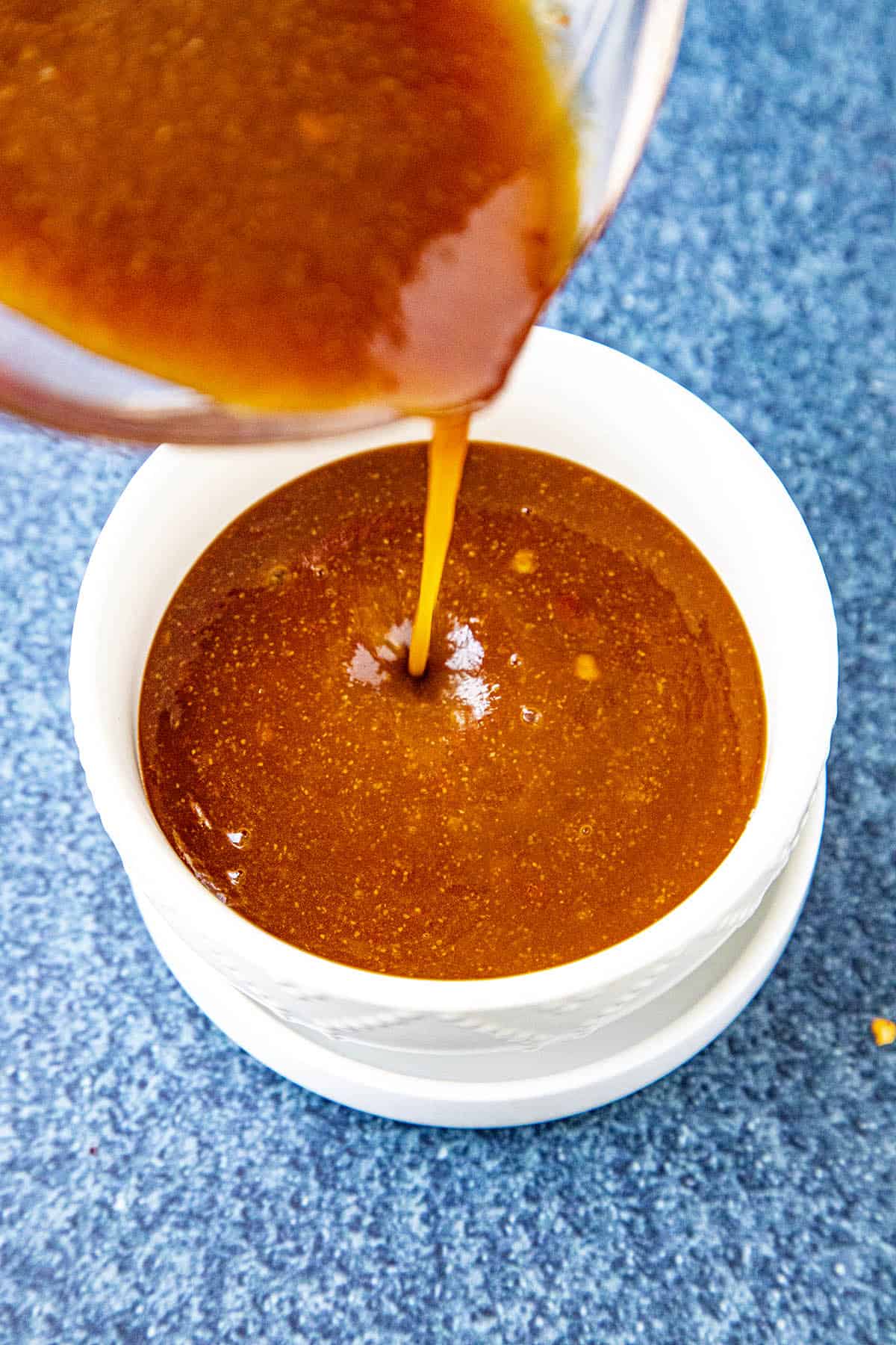 Pouring thick Szechuan Sauce into a bowl
