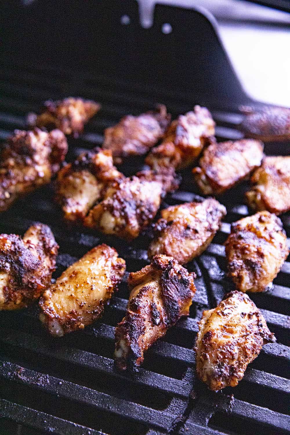 Chicken wings cooking on the grill