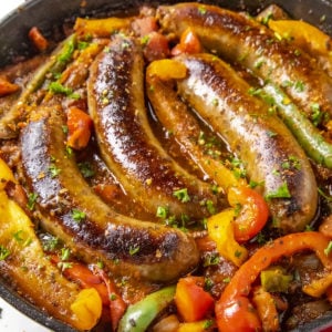 Sausage and Peppers served in a skillet.