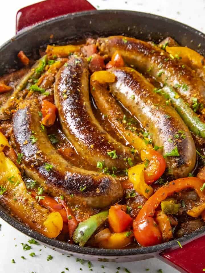 Sausage and Peppers served in a skillet.