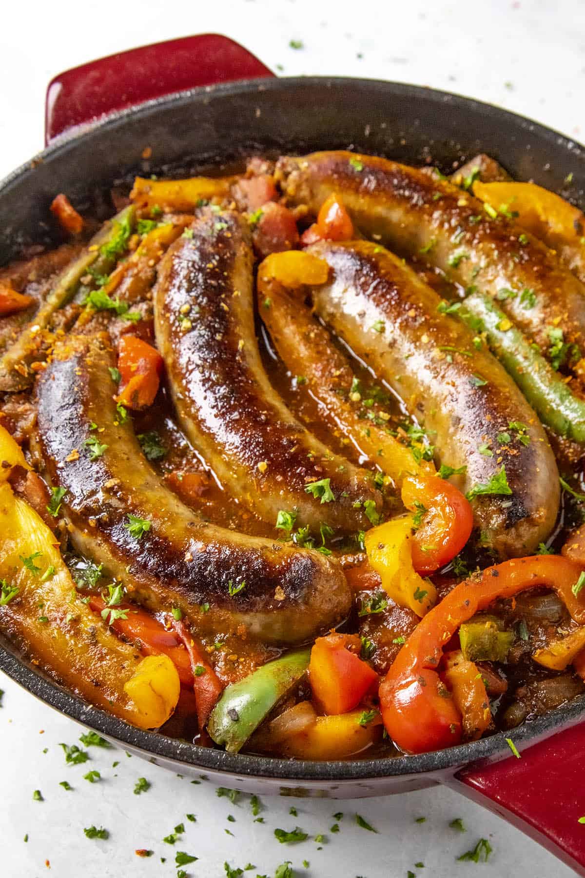 Sausage and Peppers served in a skillet.