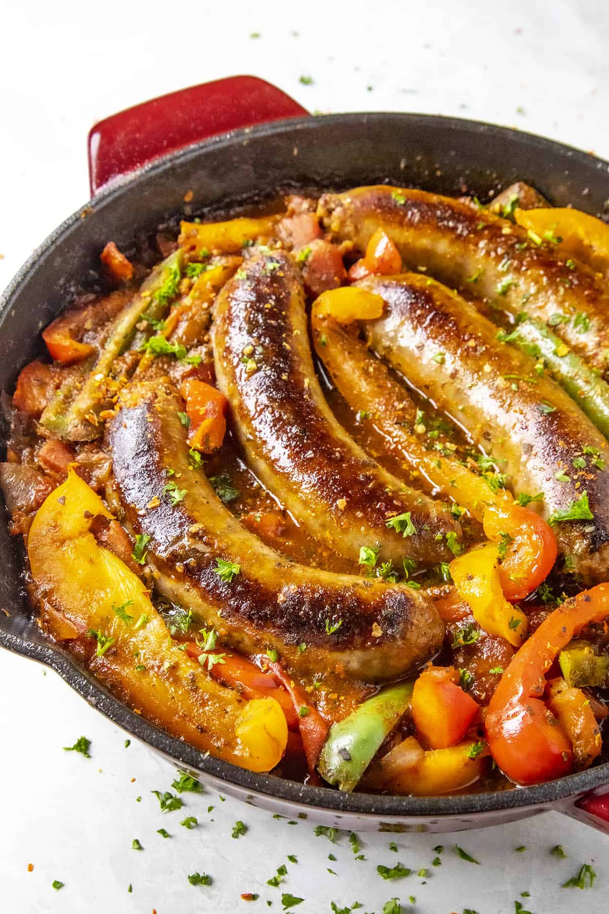 Sausage and Peppers in a hot pan, ready for dinner.