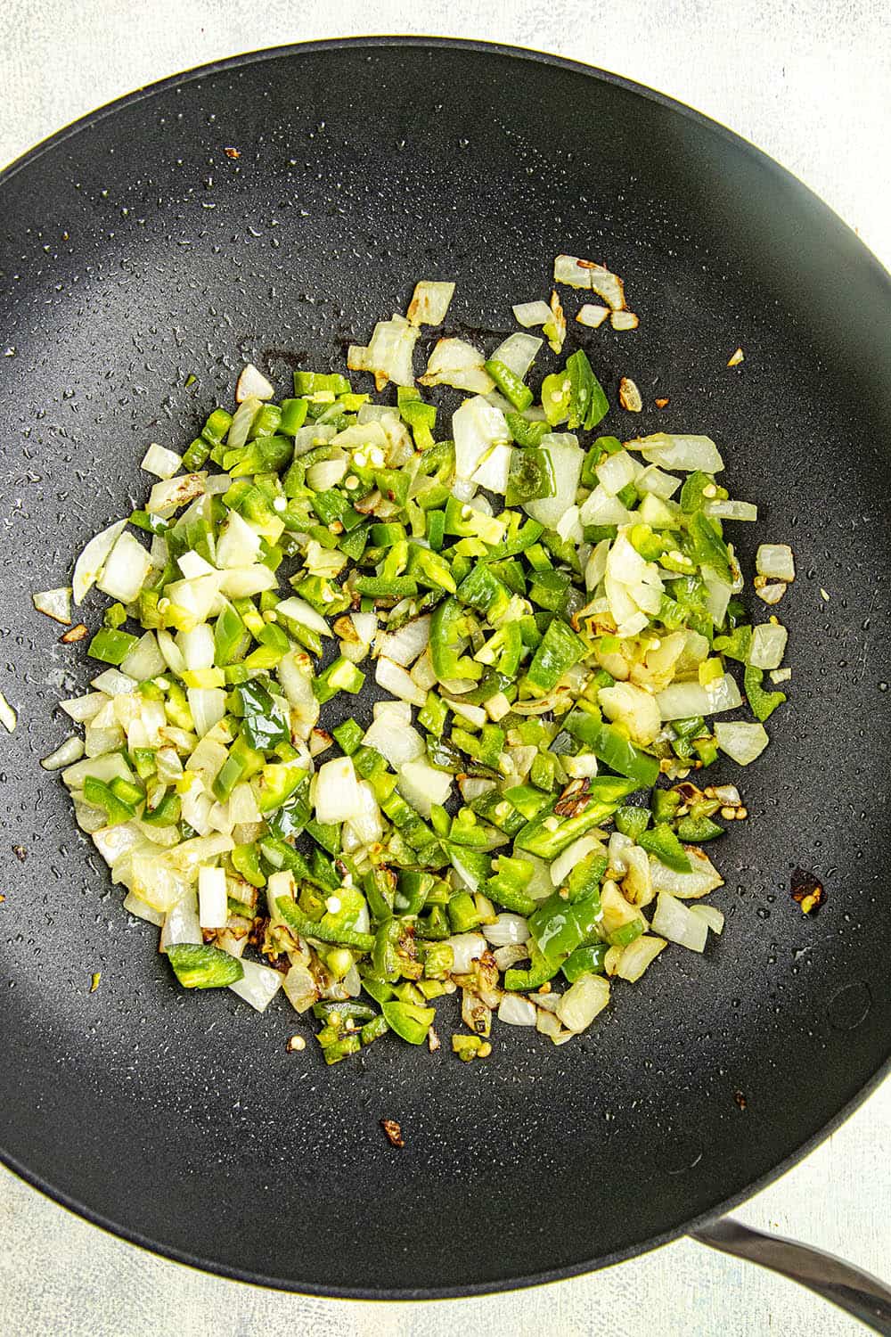 Cooking down peppers, onions and garlic to make homemade bbq sauce