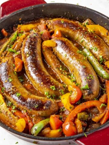 Sausage and Peppers sizzling in a pan