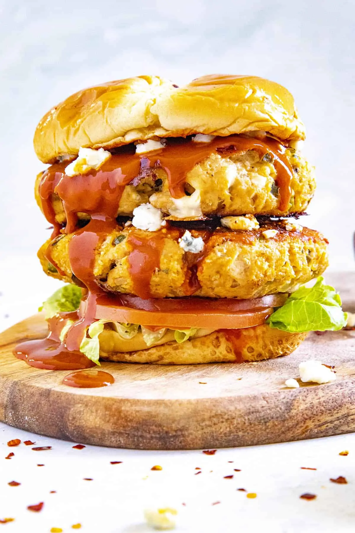 A double Buffalo chicken burger on a platter