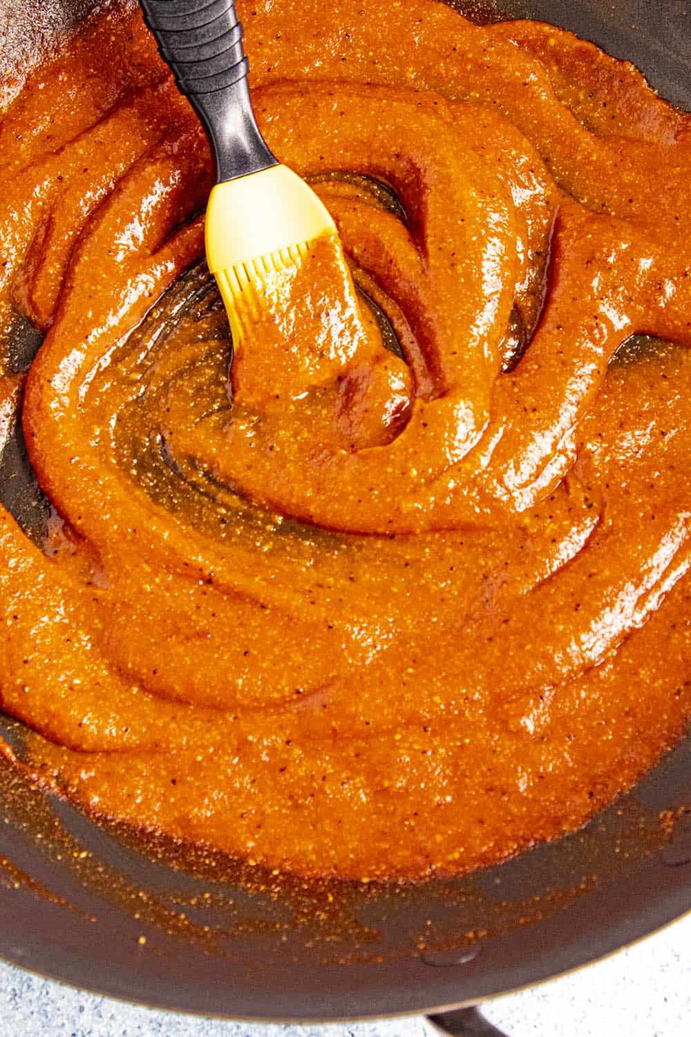 Swirling the bbq sauce in the pan