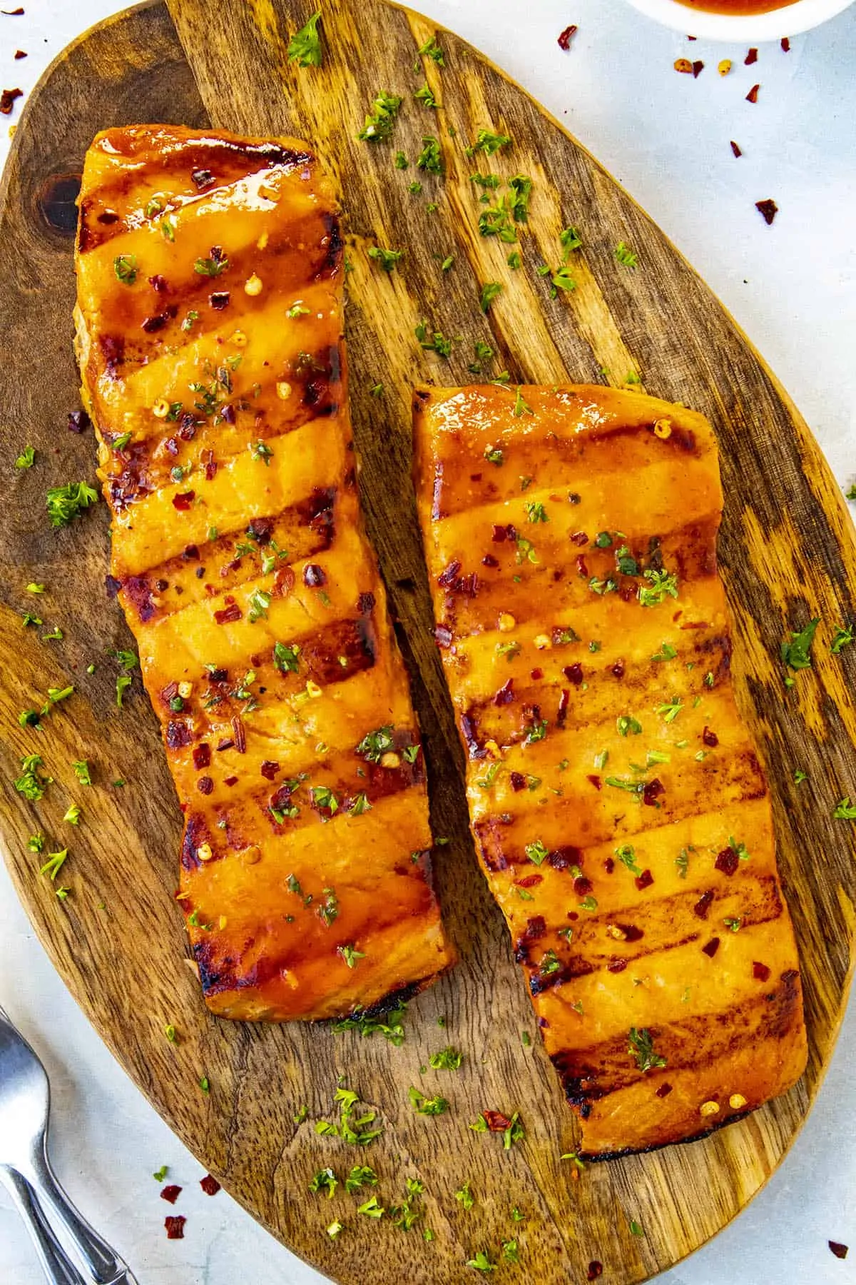 Perfectly seared grilled salmon fillets with honey sriracha sauce