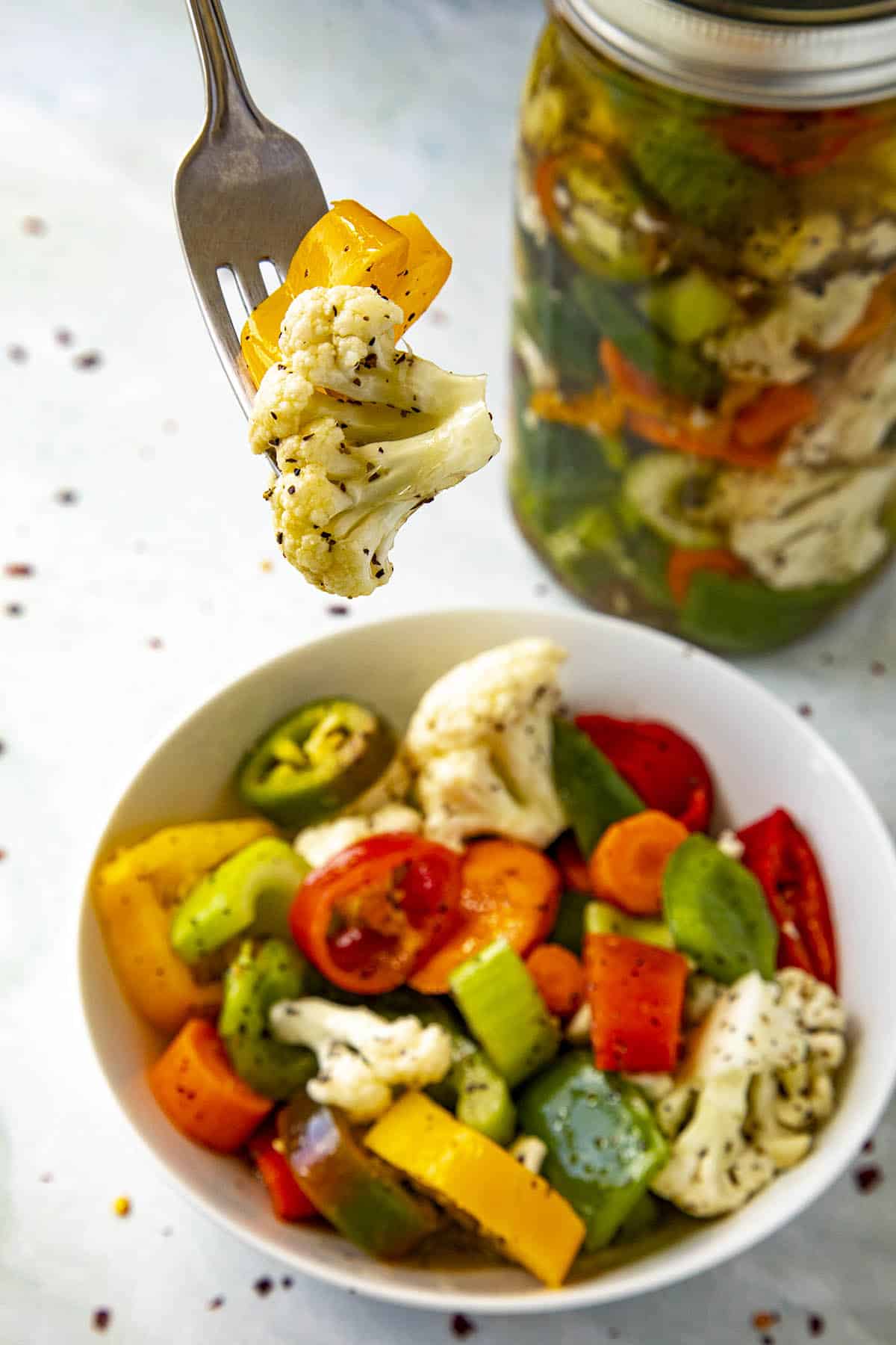 Chunks of Italian Giardiniera on a fork