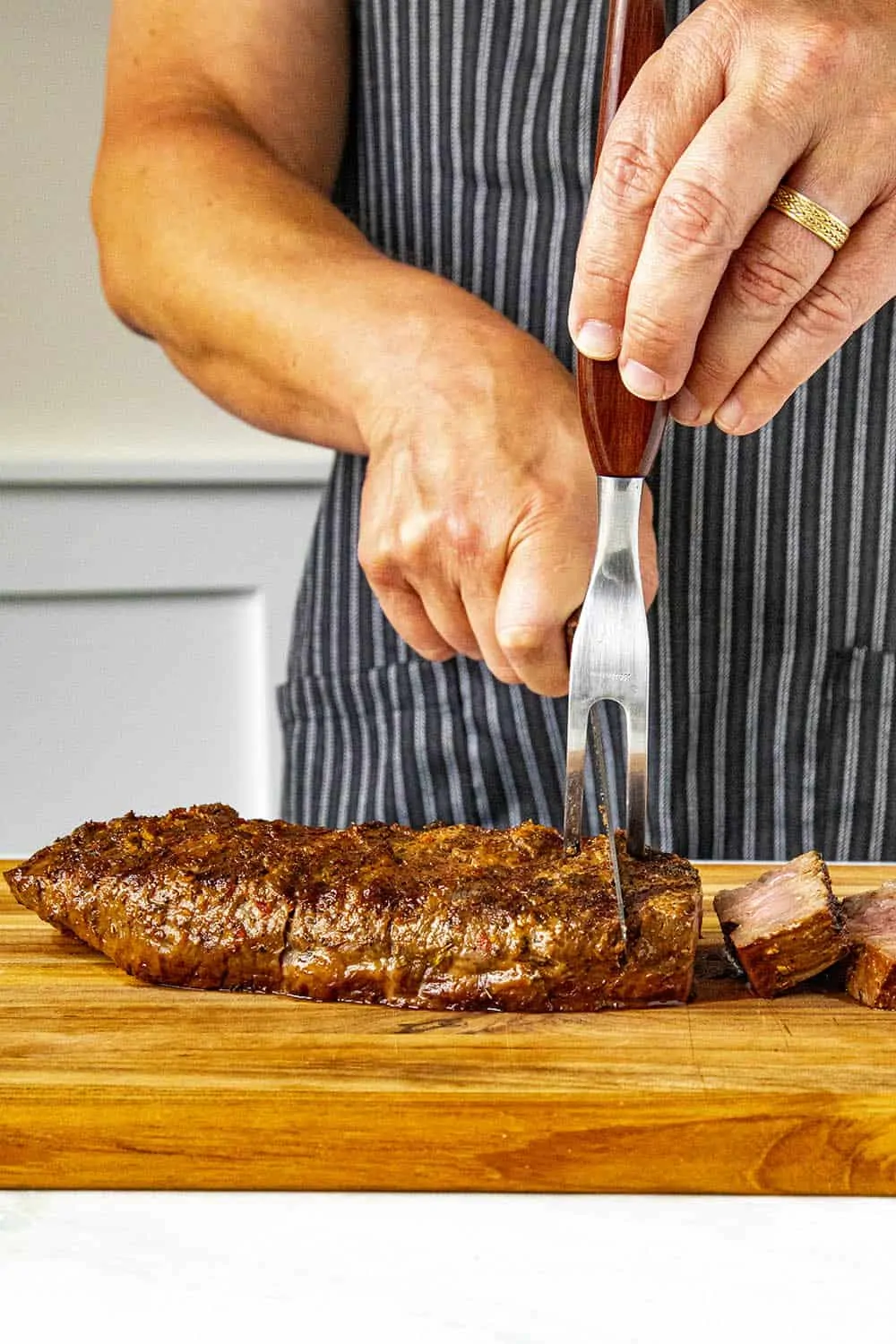 Mike slicing grilled London broil