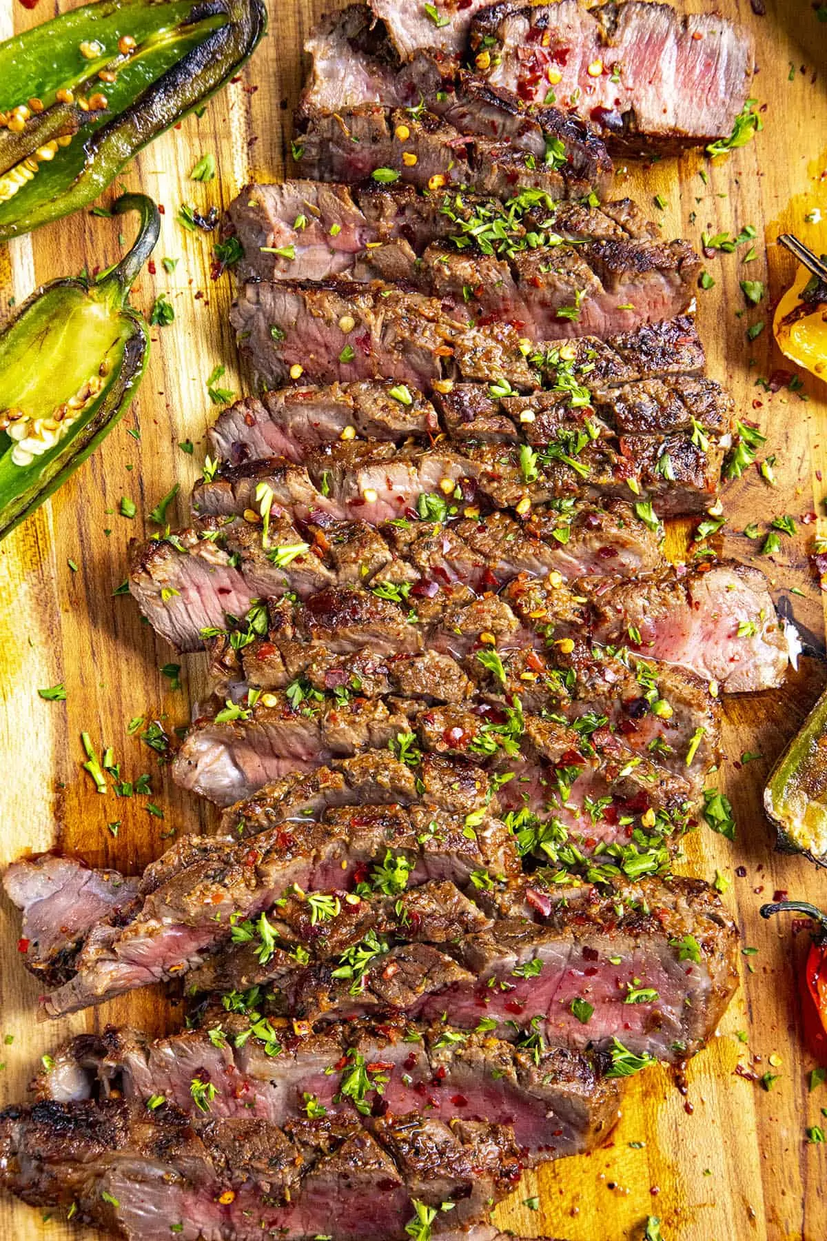 Sliced London broil on a platter with garnish