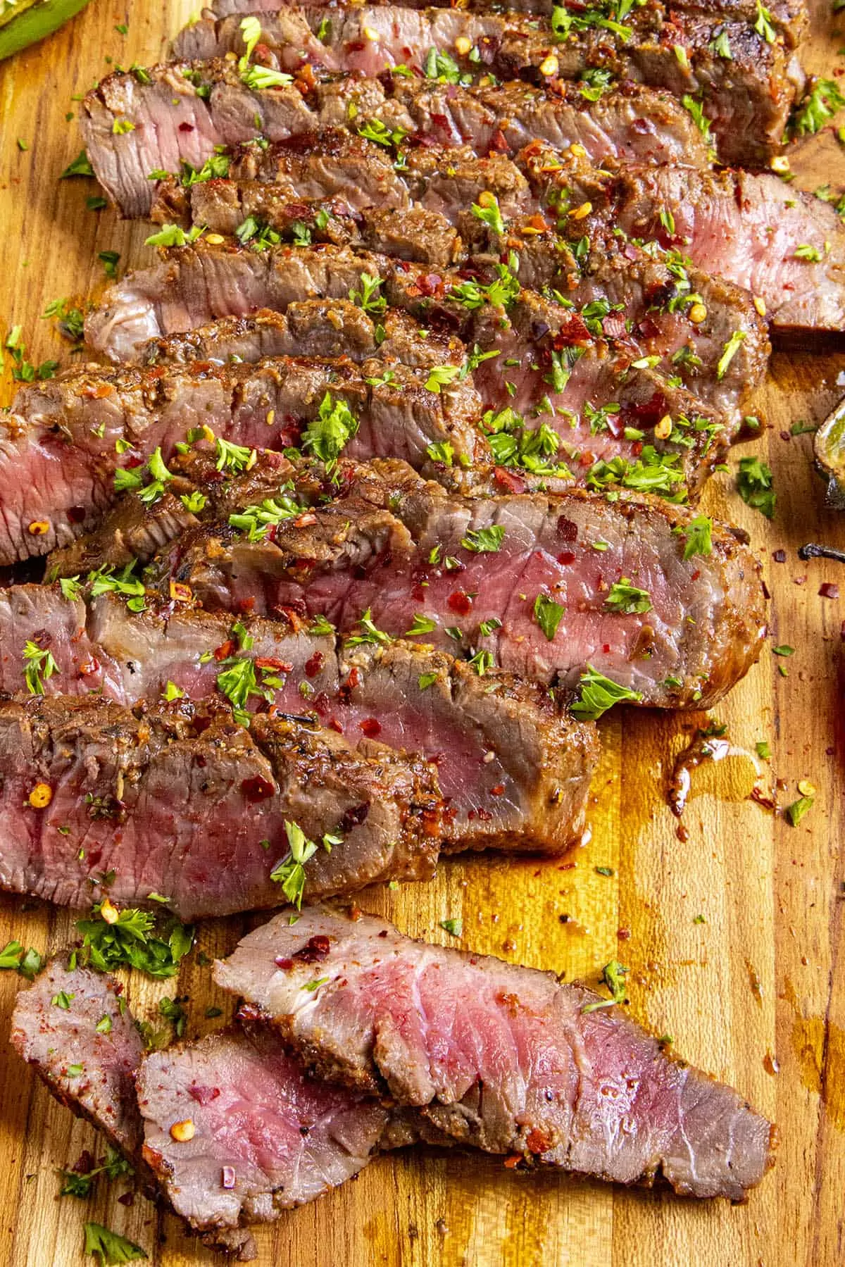 Sliced London broil on a cutting board
