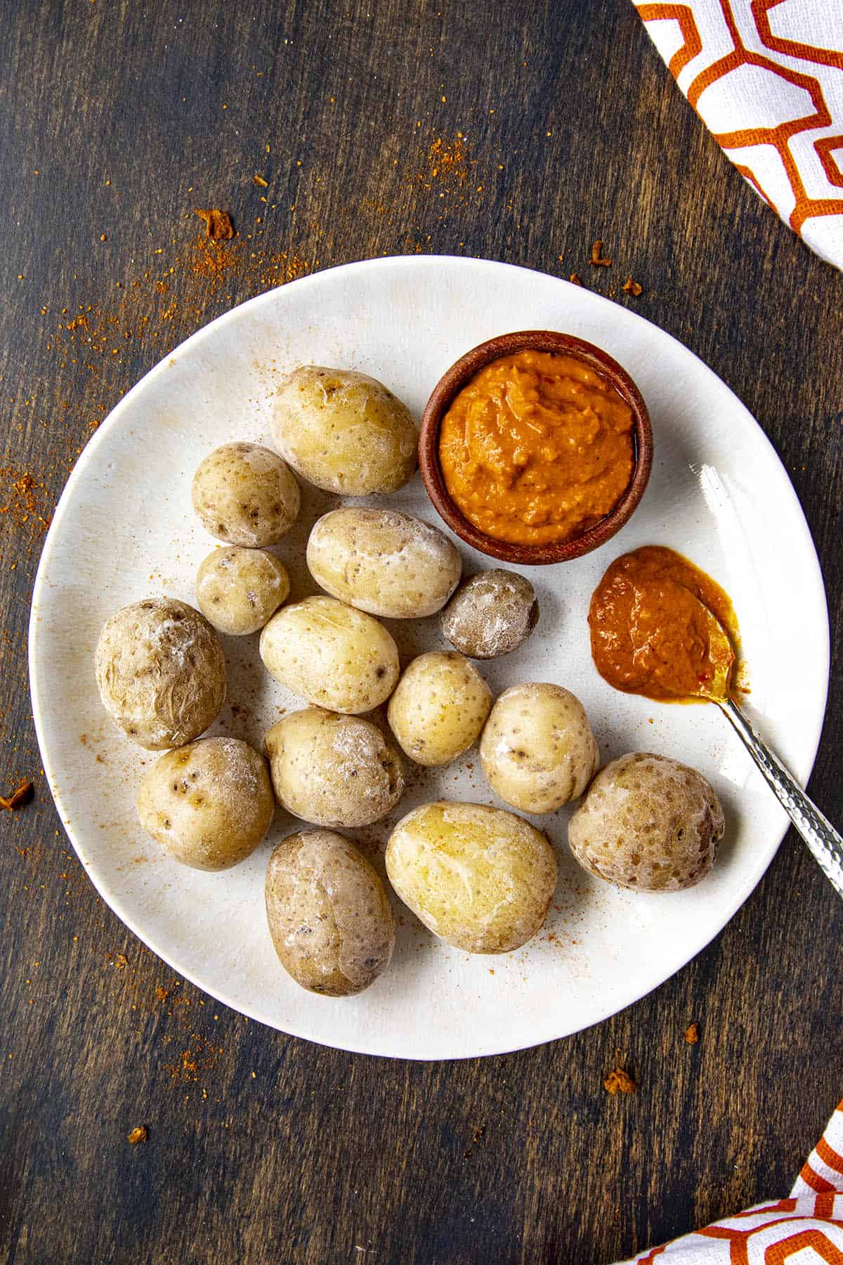 Papas Arrugadas (wrinkly potatos), on a plate with mojo picon