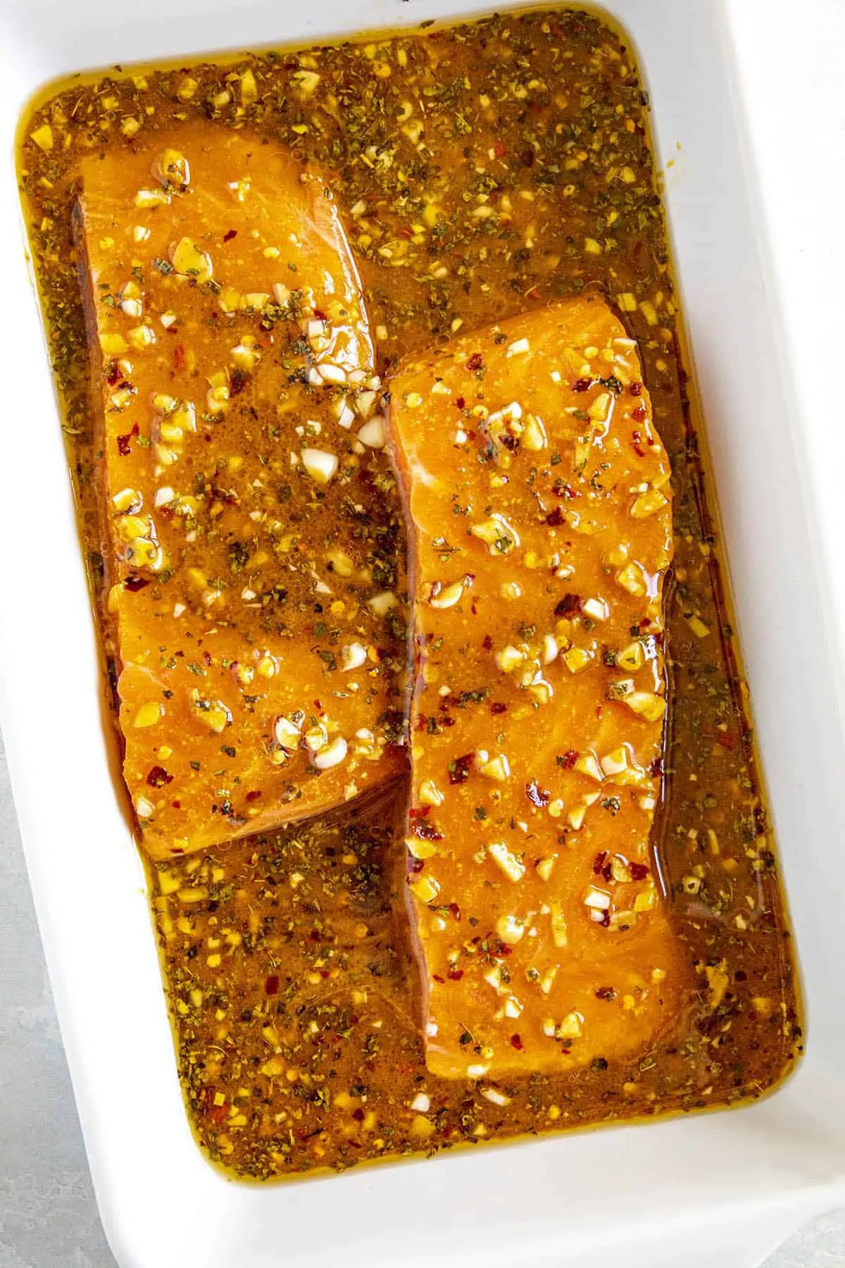 Salmon marinating in spicy marinade