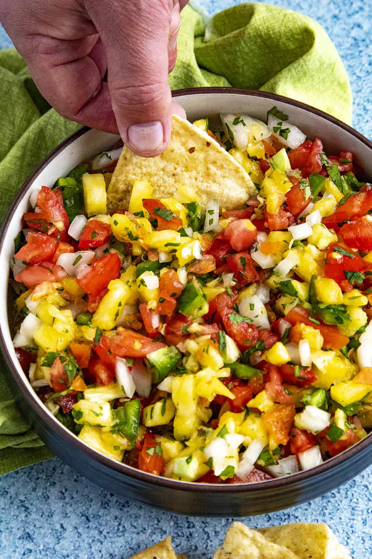 Mike scooping up some Spicy Pineapple Salsa