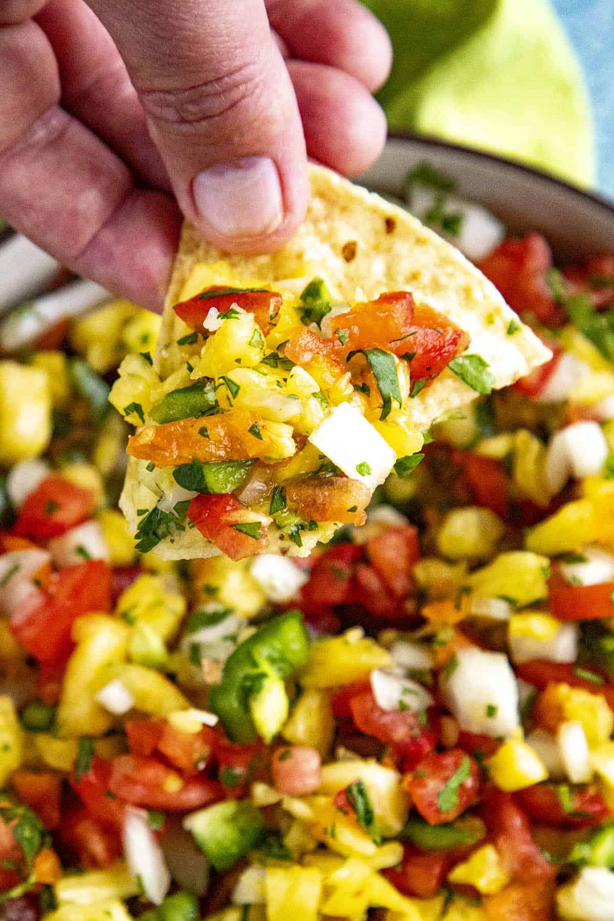 Spicy Pineapple Salsa with habanero peppers on a chip