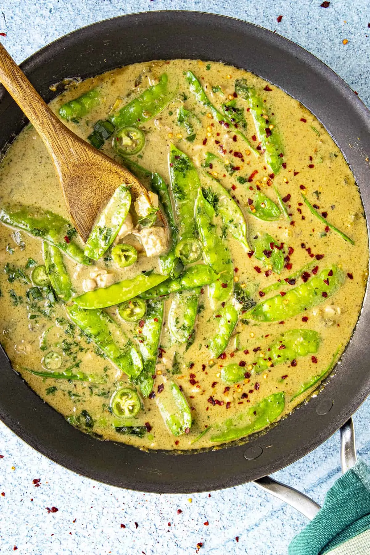 Green curry in a pan for serving.