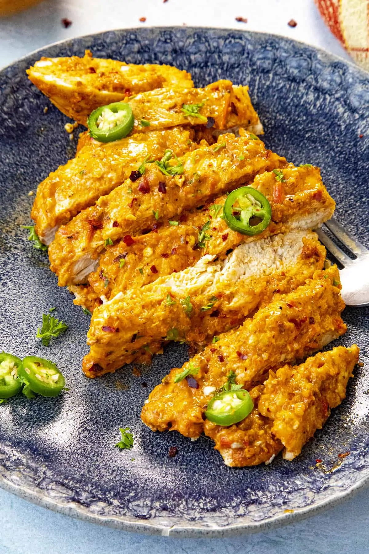 Baked Harissa Chicken Breast on a plate, ready to serve