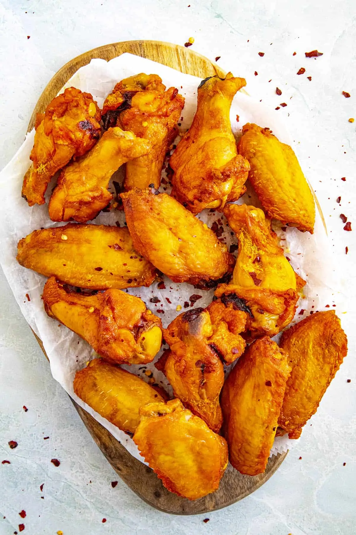 A pile of smoked chicken wings on a platter, ready to serve