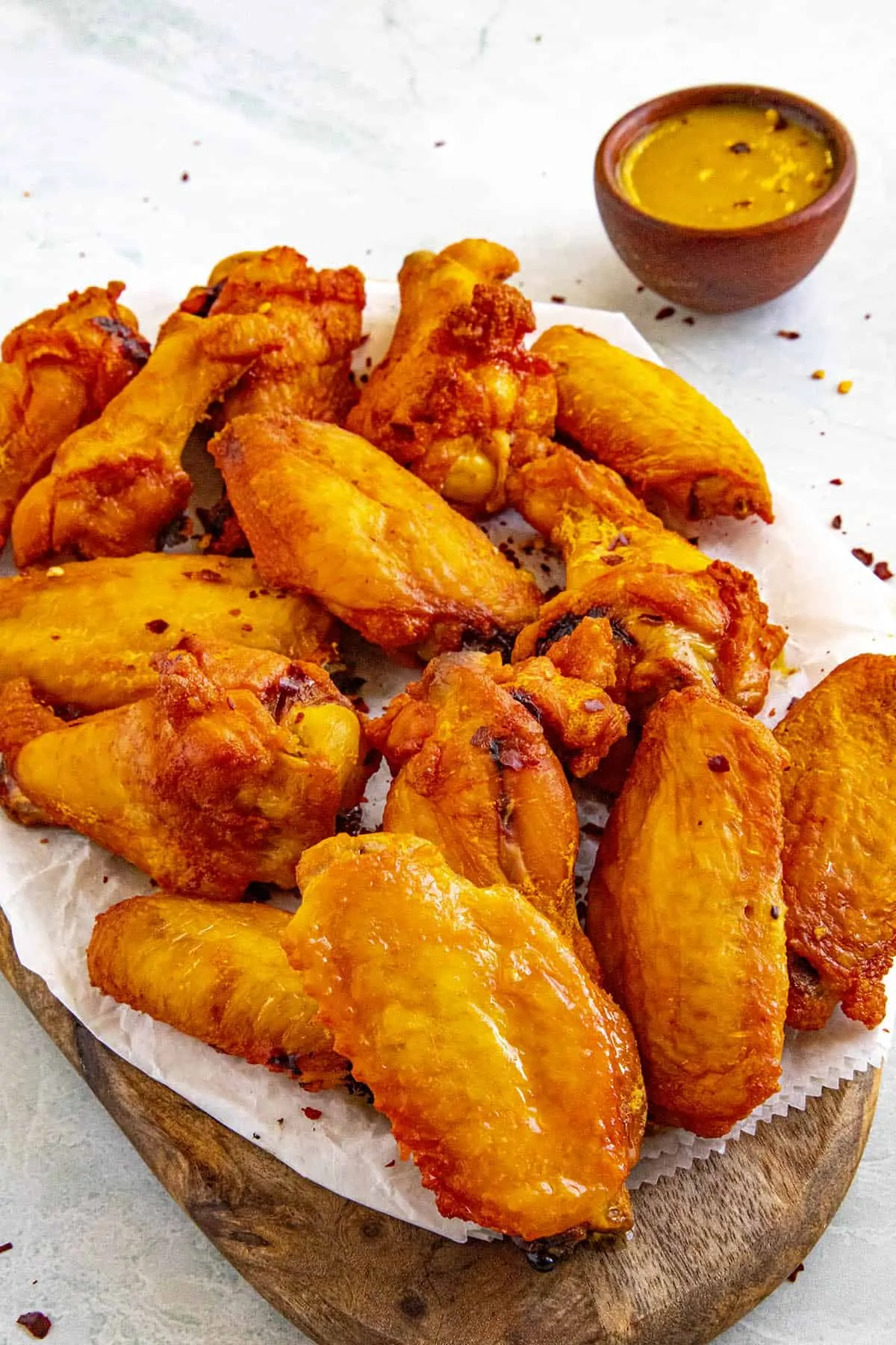 A pile of smoked chicken wings on a platter