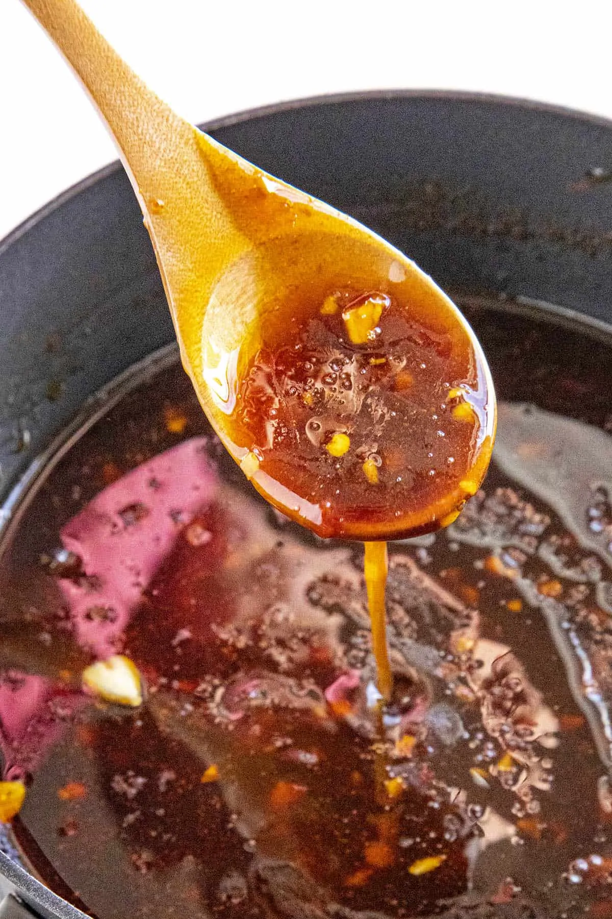 Sweet and spicy Teriyaki Sauce dripping from a spoon