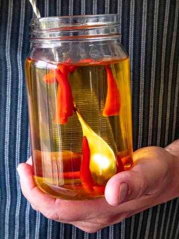 Infusing tequila with spicy chili peppers in a Ball jar