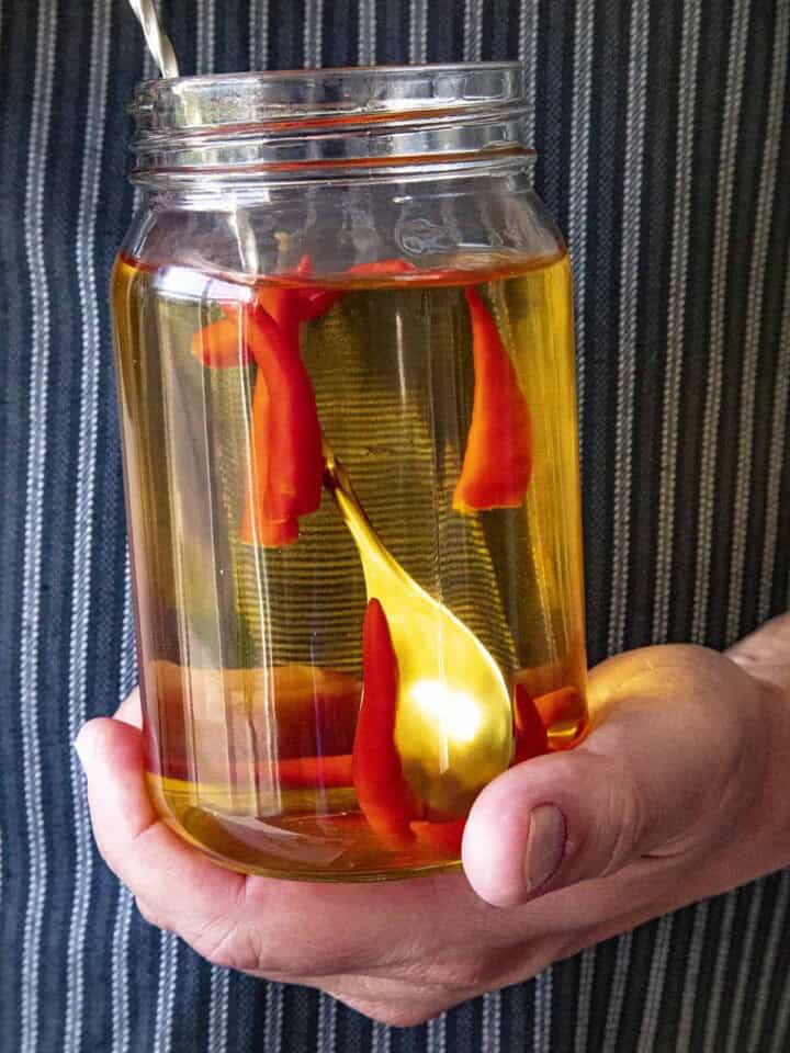 Infusing tequila with spicy chili peppers in a Ball jar