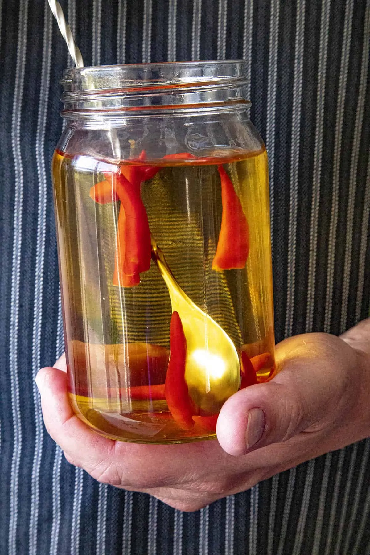 Infusing tequila with spicy chili peppers in a Ball jar