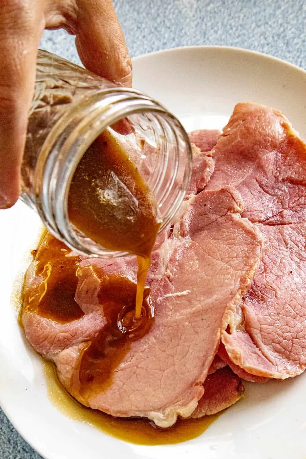 Pouring Red Eye Gravy over slices of country ham