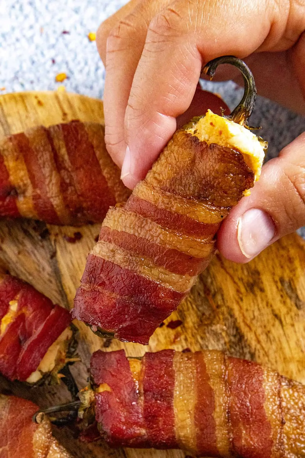 Close up of a spicy bacon wrapped smoked jalapeno popper