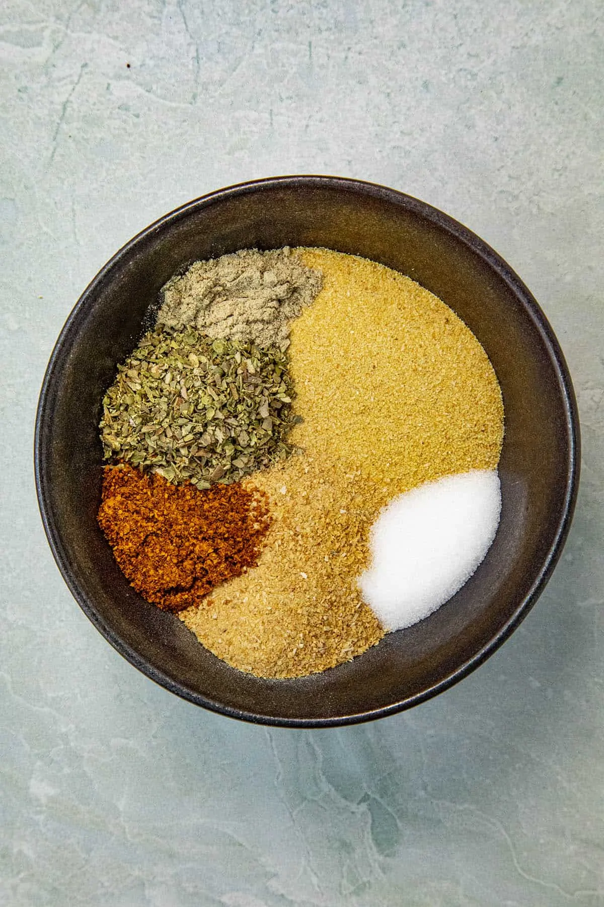 Adobo Seasoning ingredients in a bowl, ready to mix